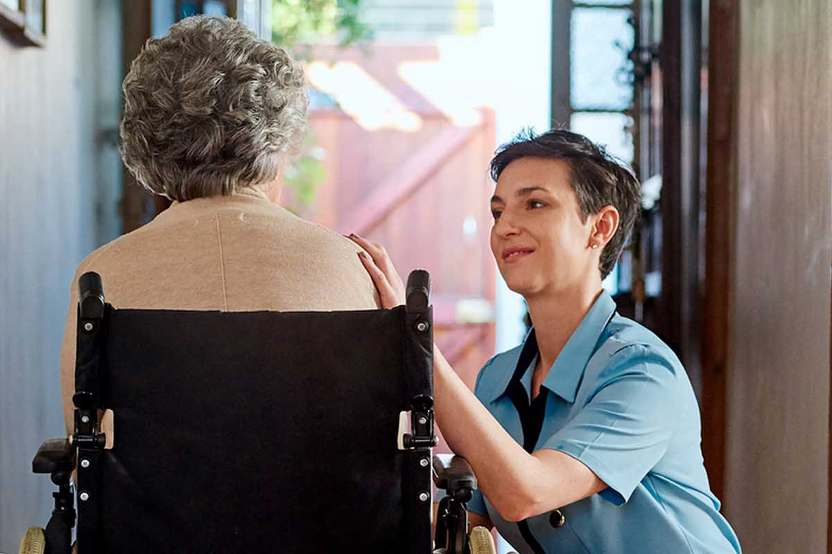 Nurse with patient for who we are page